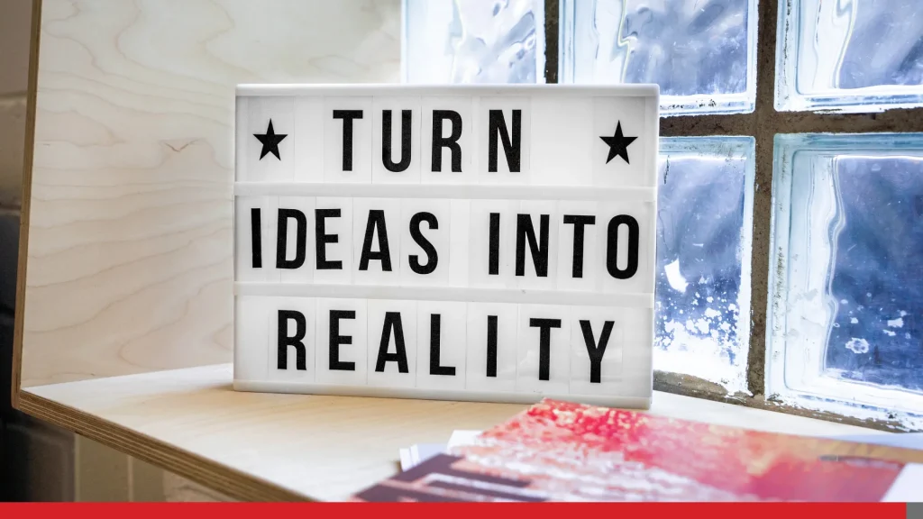 Stand with tiles reading turn ideas into reality