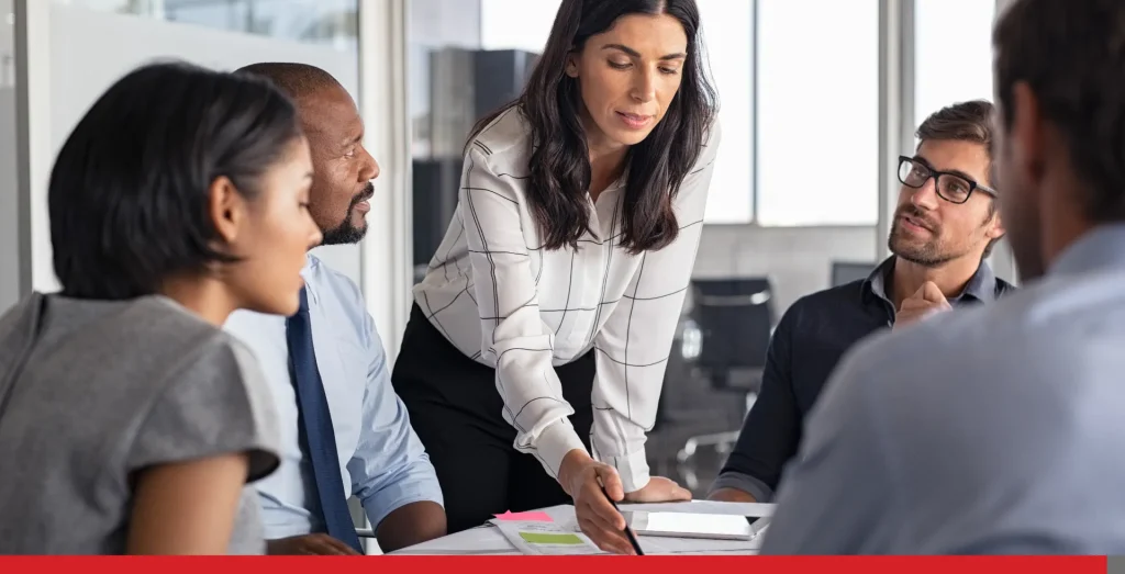 People in a meeting room working