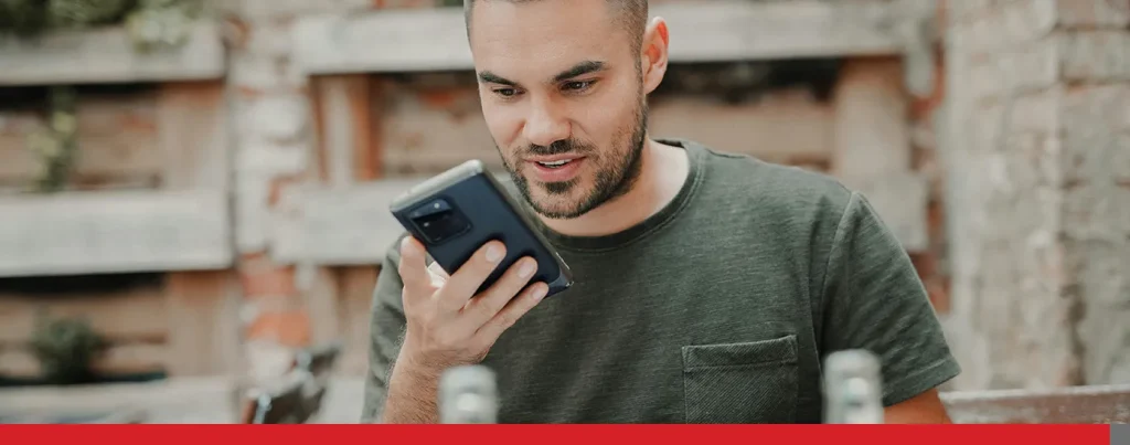 A man speaking to his smartphone