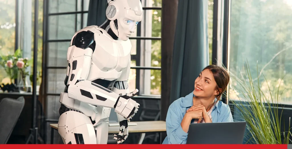 Woman working on her laptop while the robot helps her.