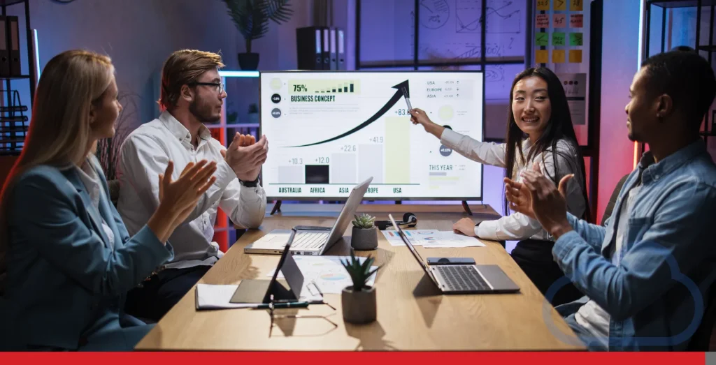 Asian woman showing financial report for colleagues.