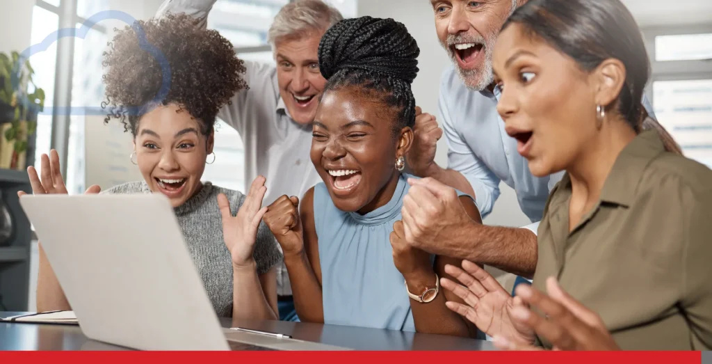 We cant contain our excitement. Shot of a group of businesspeople using a laptop at work.