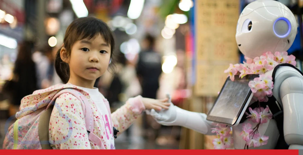 A young girl shakes the hand of a robot