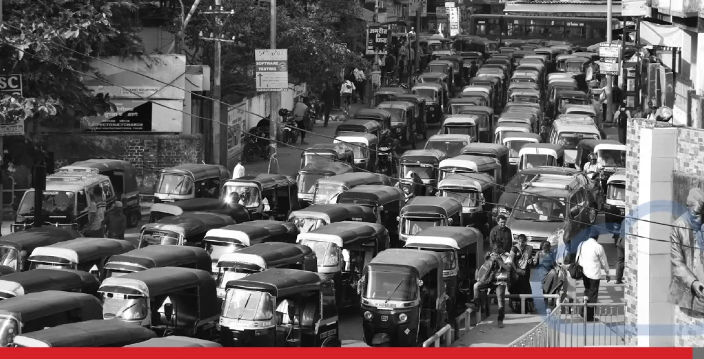 A large queue of autorickshaws creates heavy traffic in Mumbai, India.