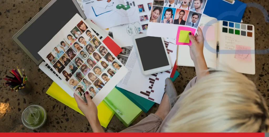 Businesswoman holding documents sitting on floor at creative office.